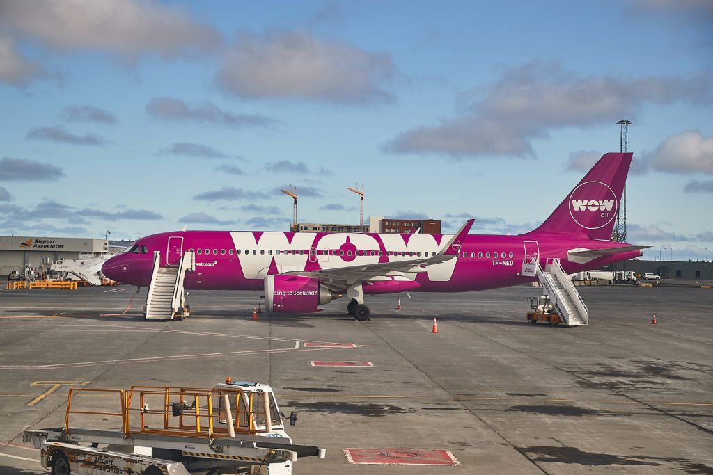WOW Air plane parked on tarmac 